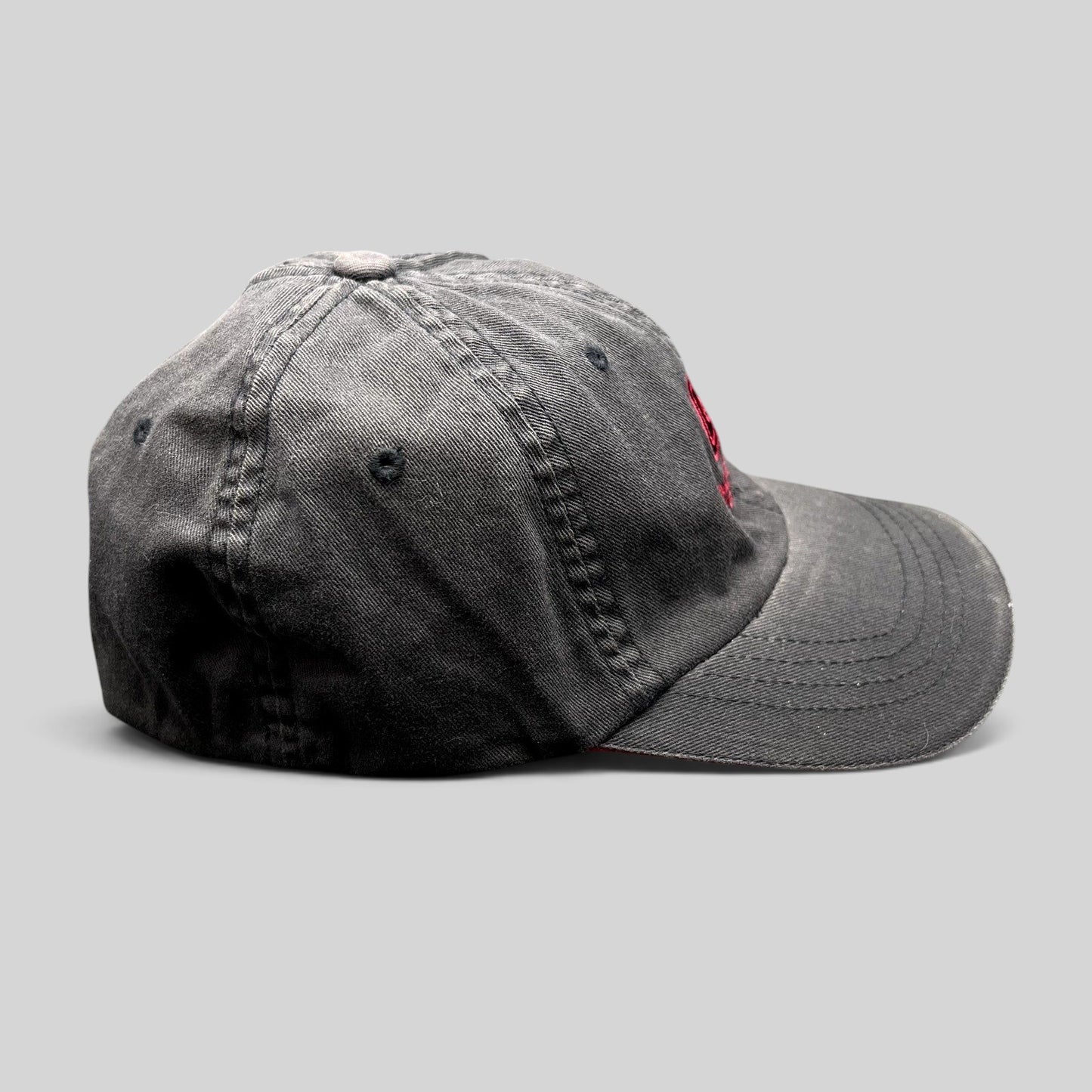 Raree Finds vintage Warren Miller Entertainment black Flexfit hat with red embroidered logo and brim piping