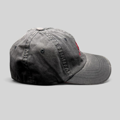 Raree Finds vintage Warren Miller Entertainment black Flexfit hat with red embroidered logo and brim piping
