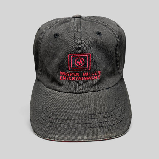 Raree Finds vintage black Warren Miller Entertainment Flexfit hat with red embroidered logo and brim piping