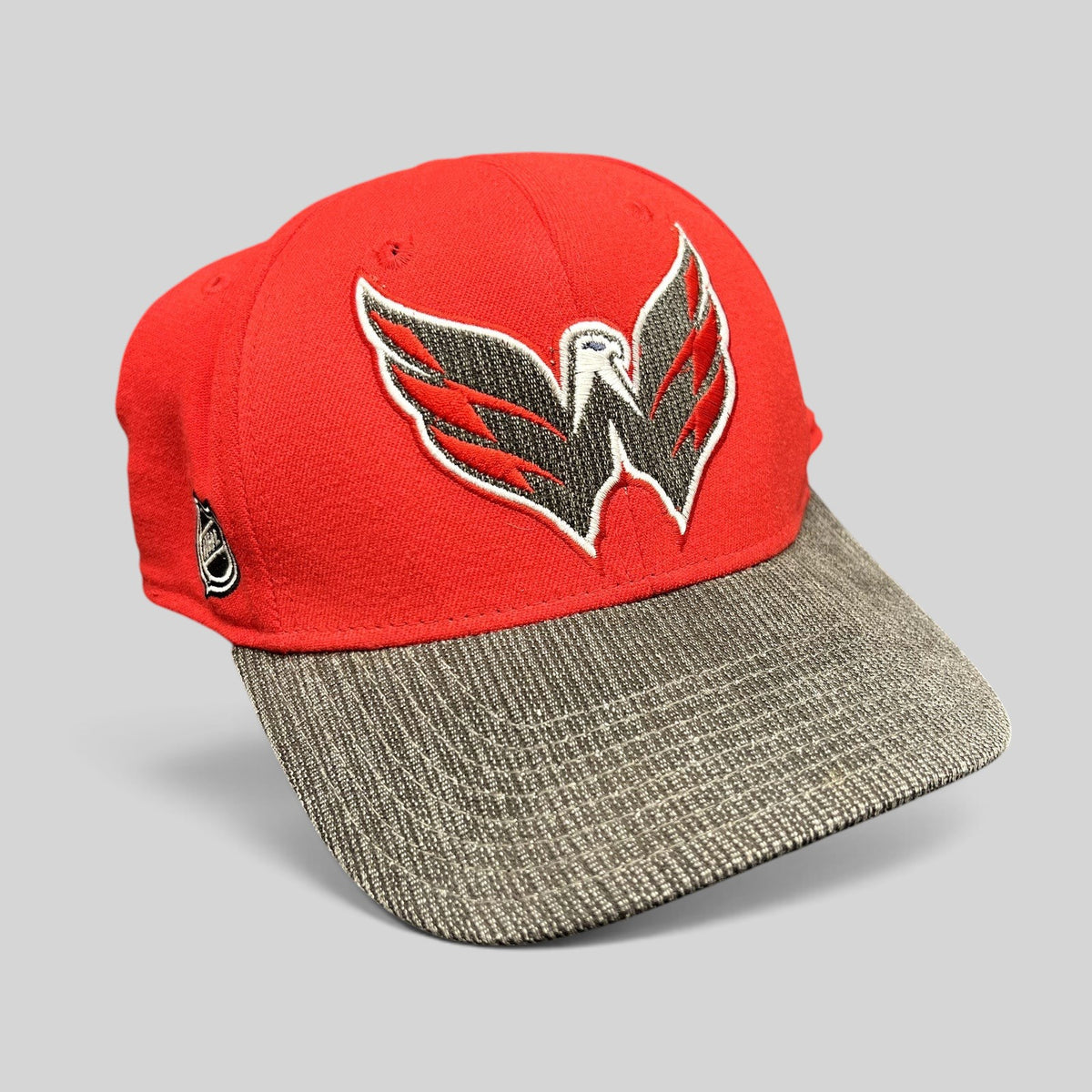 Raree Finds Washington Capitals Reebok Center Ice fitted hat in red with a textured gray brim and eagle logo