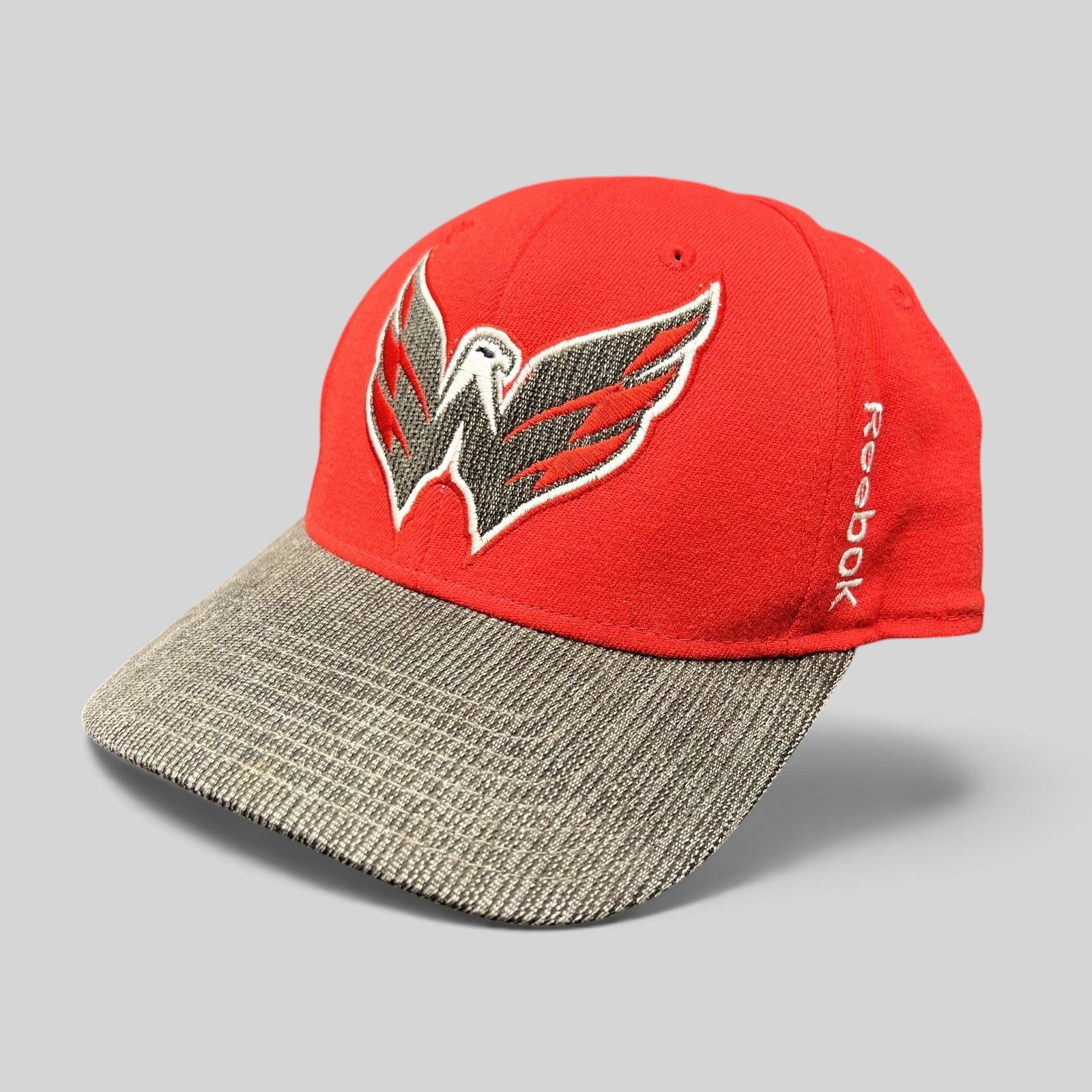 Raree Finds Washington Capitals Reebok Center Ice fitted hat in red and gray with an embroidered eagle logo.
