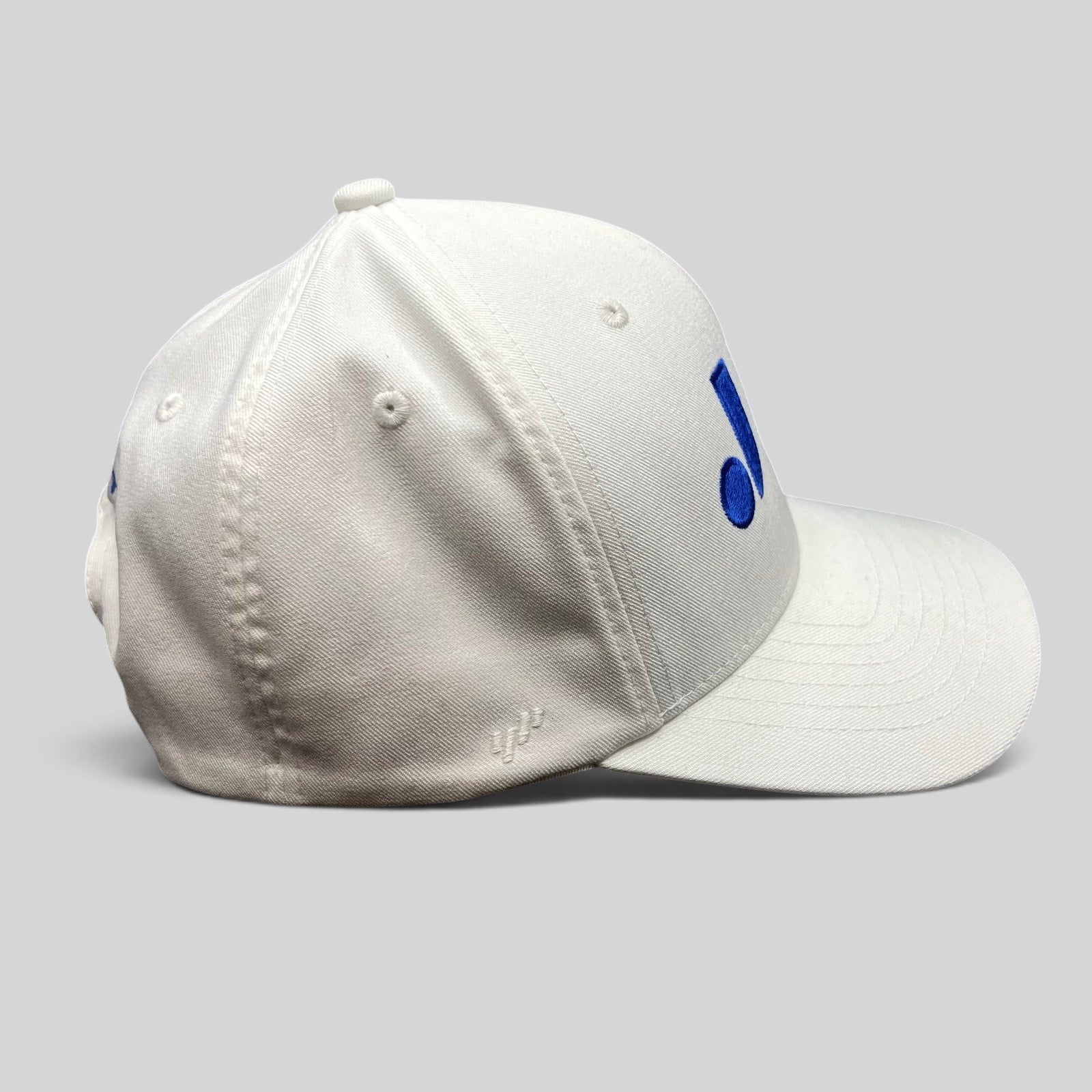Raree Finds white Flexfit NU snapback hat with royal blue embroidered logo on the side panel