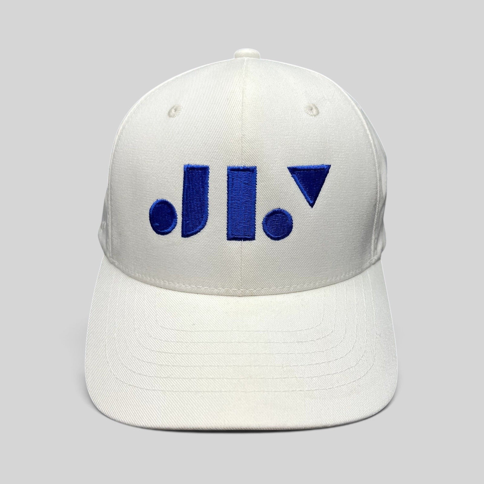 Raree Finds white Flexfit NU snapback hat with a royal blue geometric Just Like You Films logo on the front
