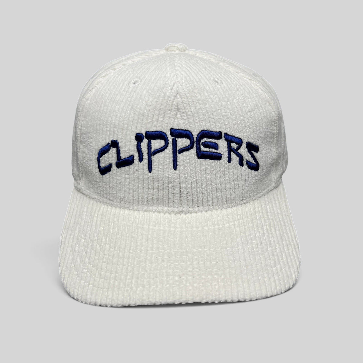 Raree Finds white corduroy Los Angeles Clippers strapback hat with royal blue embroidered wordmark on the front