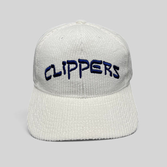 Raree Finds white corduroy Los Angeles Clippers strapback hat with royal blue embroidered wordmark on the front