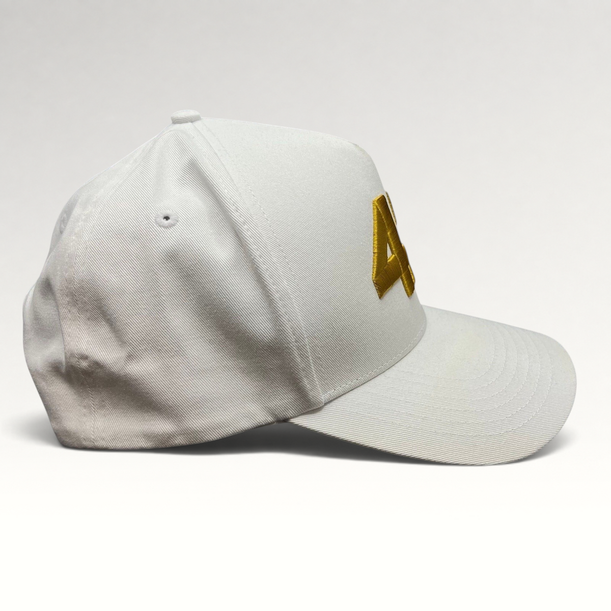 Raree Finds white cotton snapback hat with bold gold 47 embroidery and a structured flat brim profile