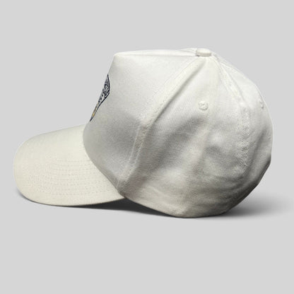 Raree Finds vintage white Massachusetts State Police snapback hat with embroidered triangular crest, side profile view.