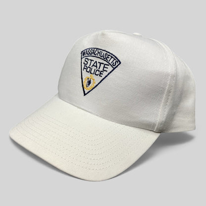 Raree Finds vintage white Massachusetts State Police snapback hat with embroidered navy and gold triangular patch.