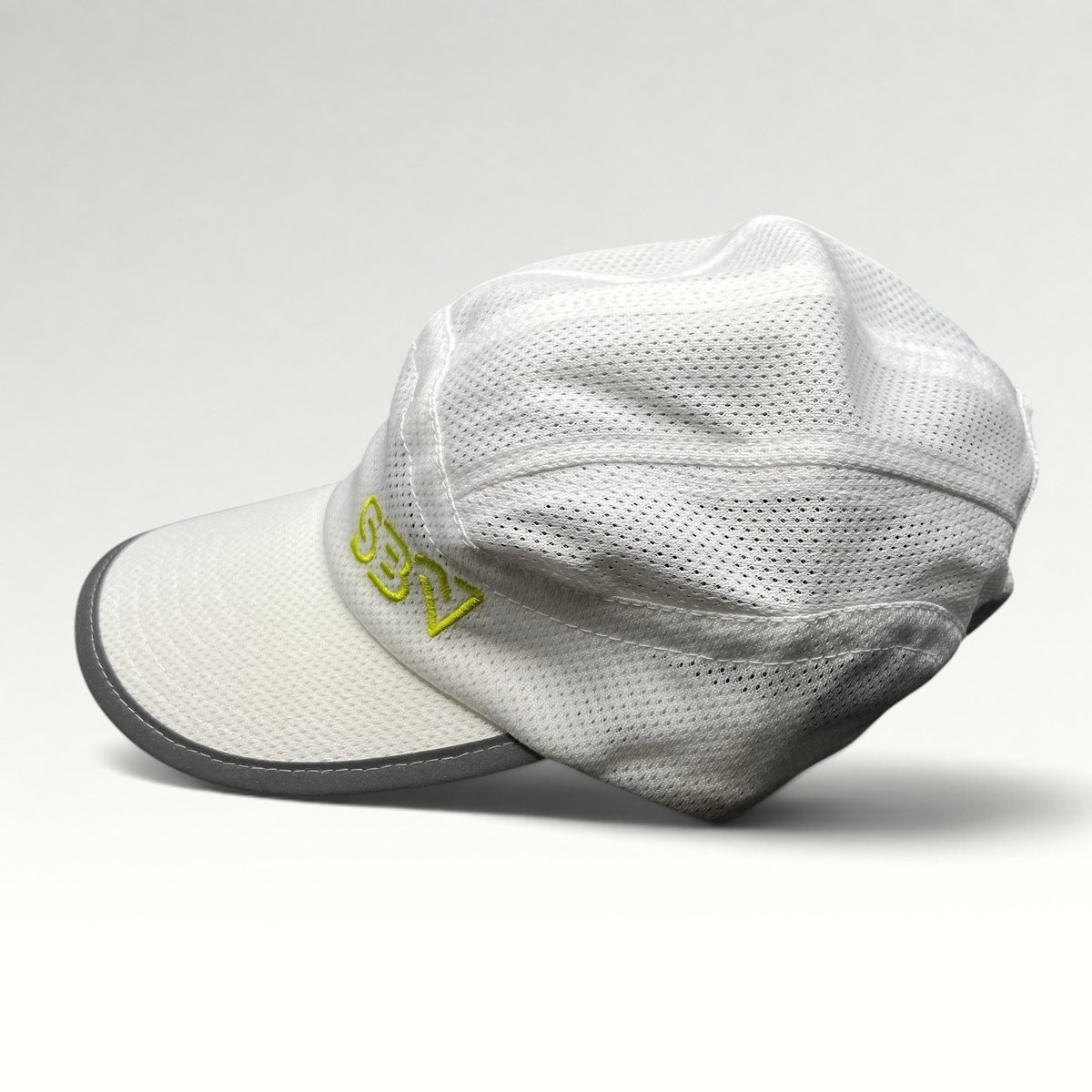 Raree Finds white performance 5-panel running cap with breathable mesh, reflective brim, and lime green SBV logo.