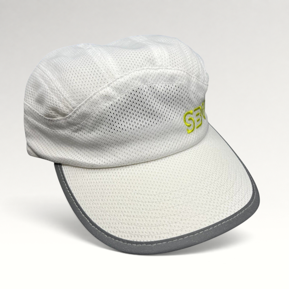 Raree Finds white 5-panel performance running cap with breathable mesh, reflective brim trim, and lime green SBV logo.