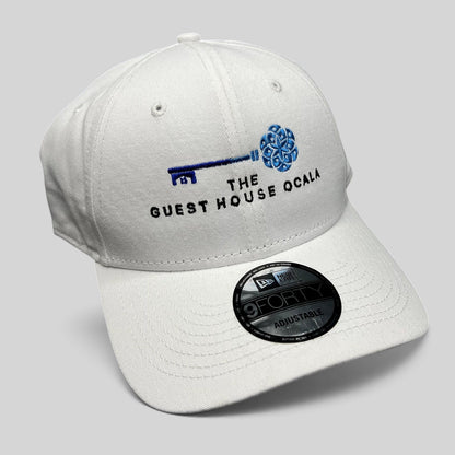 Raree Finds white New Era 9FORTY strapback hat with The Guest House Ocala blue key embroidery and curved brim