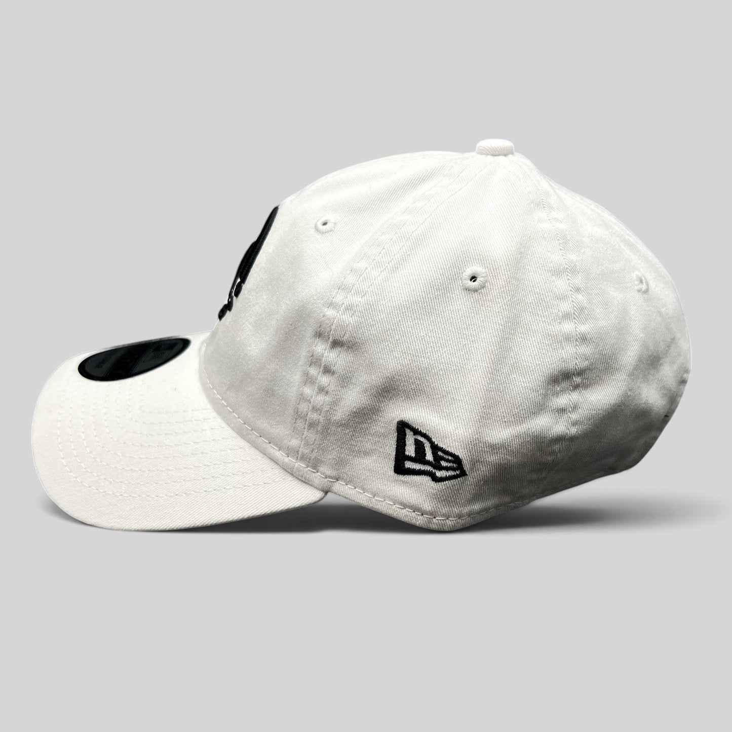 Raree Finds white New Era 9TWENTY dad cap with black embroidered Music logo and side flag on cotton fabric