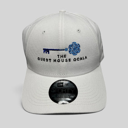 Raree Finds white New Era 9FORTY strapback hat with The Guest House Ocala blue key embroidery and curved brim