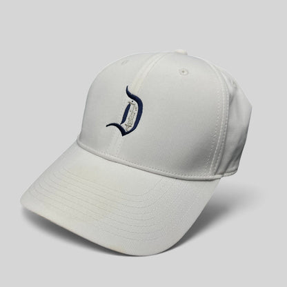 Raree Finds white Nike Legacy 91 Disney collaboration cap featuring an embroidered D logo on the front
