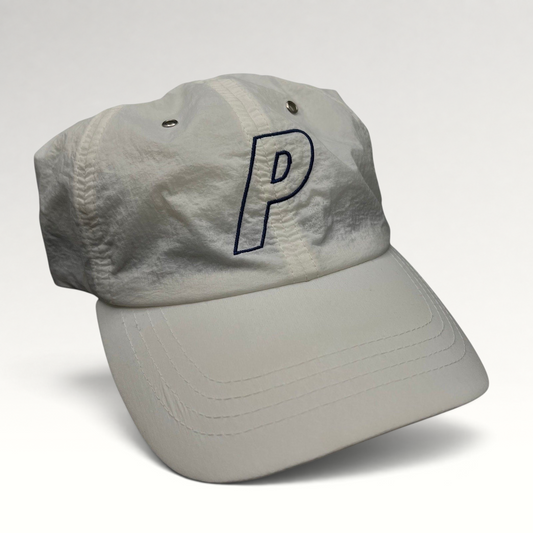 Raree Finds white Palace Skateboards nylon strapback hat with an embroidered navy blue P logo on the front crown.