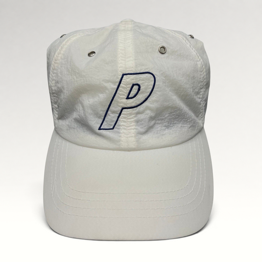 Raree Finds white Palace Skateboards strapback hat with an embroidered navy blue P logo on a lightweight nylon crown