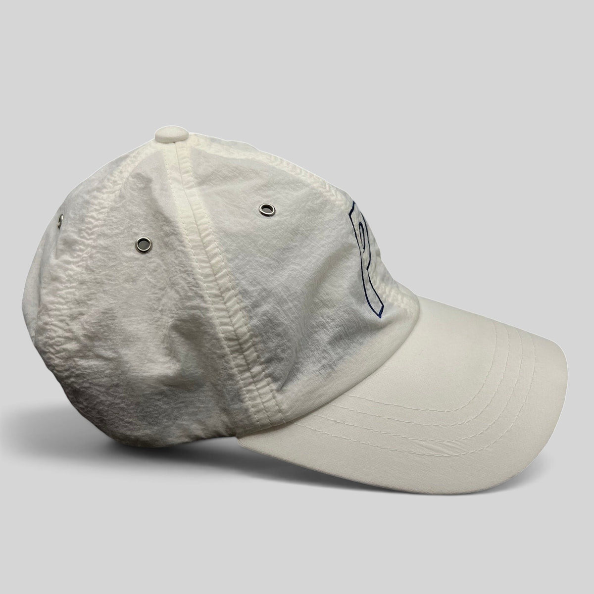 Raree Finds white Palace Skateboards strapback hat with an embroidered P logo on a lightweight nylon crown