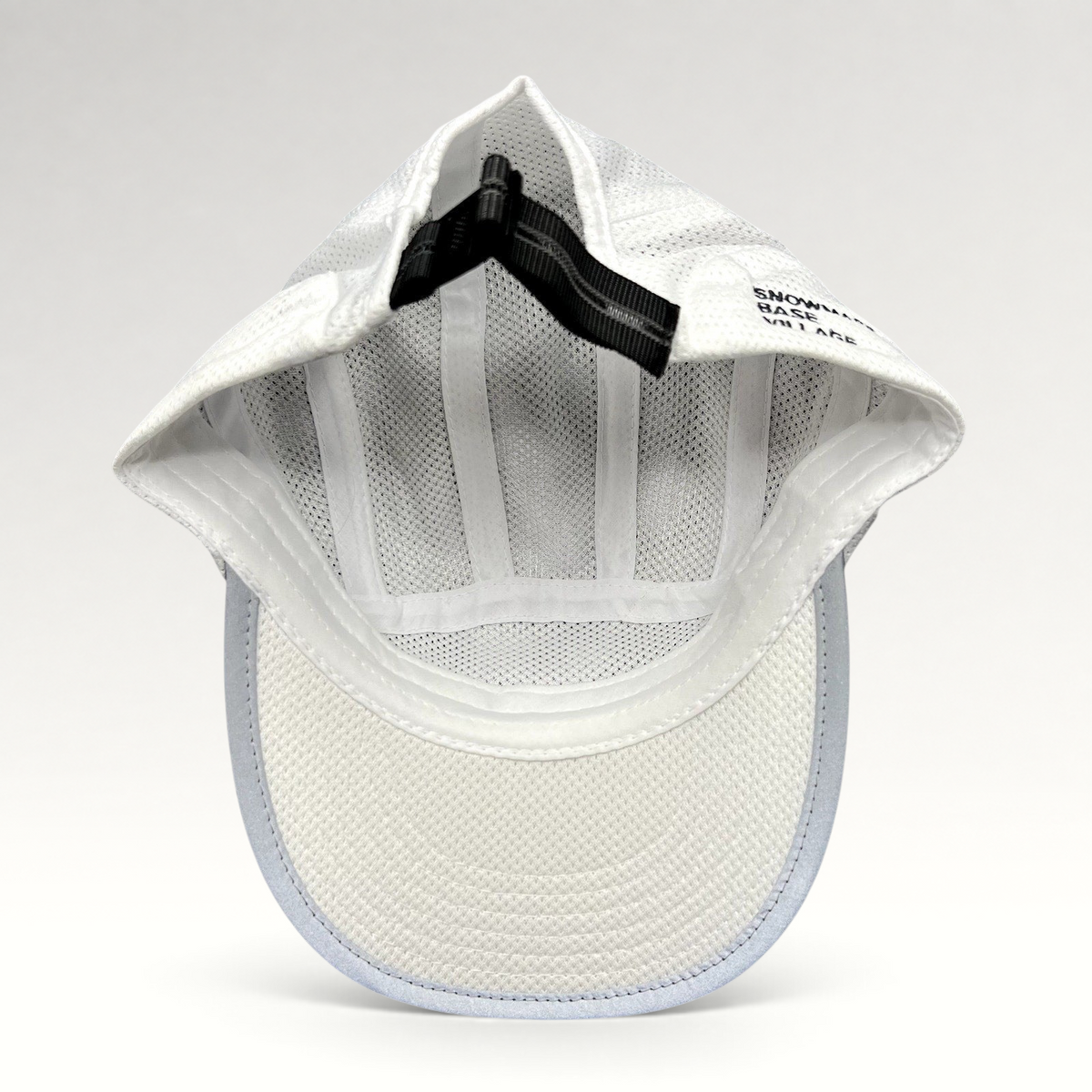 Raree Finds white 5-panel performance running hat interior showing breathable mesh and adjustable rear buckle strap.