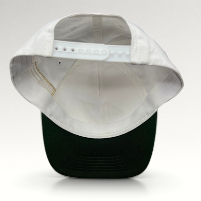 Raree Finds white cotton snapback hat with a green undervisor and adjustable plastic snap closure, back view.