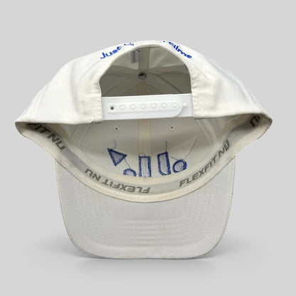 Raree Finds white Flexfit NU snapback hat showing interior royal blue embroidery and adjustable plastic strap