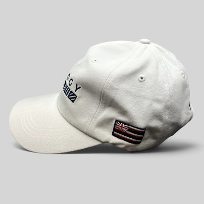 Raree Finds white cotton strapback cap with Trilogy branding and embroidered Hawaii flag on the side