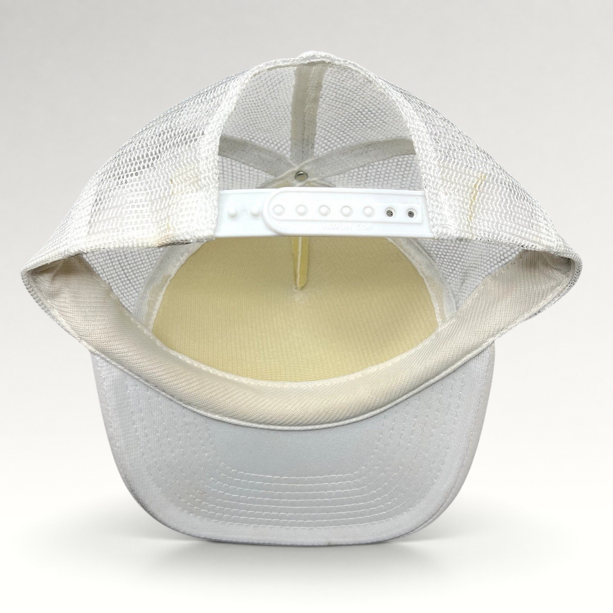 Raree Finds white Y2K Rockstar Energy Drink trucker hat with mesh back and snapback closure, back view