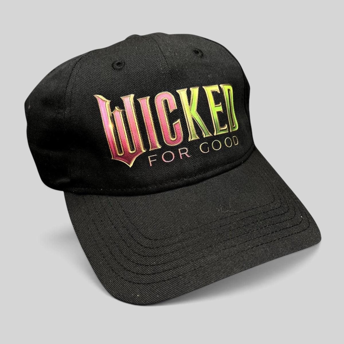 Raree Finds black cotton strapback hat with colorful Wicked For Good embroidered logo and curved brim