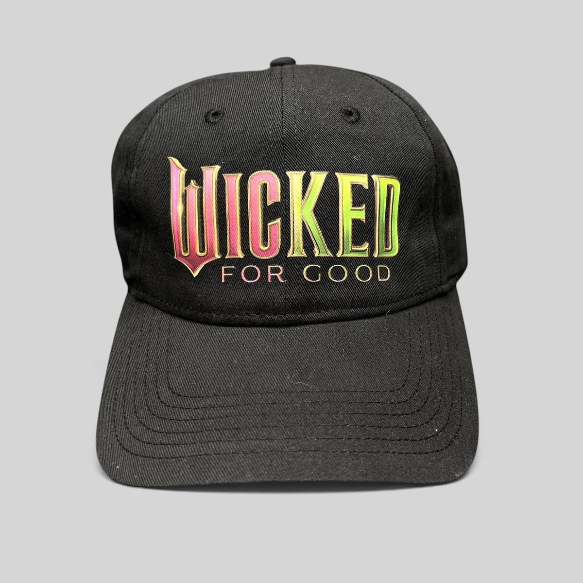 Raree Finds black cotton strapback hat with colorful Wicked For Good Broadway musical embroidery and curved brim