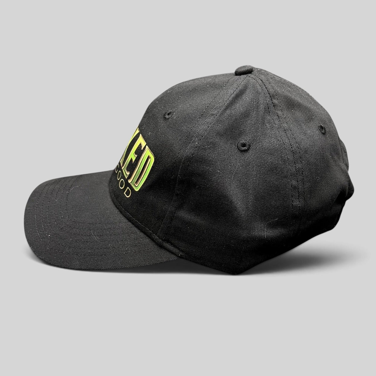 Raree Finds black cotton strapback hat with Wicked For Good colorful gradient embroidery and a curved brim.