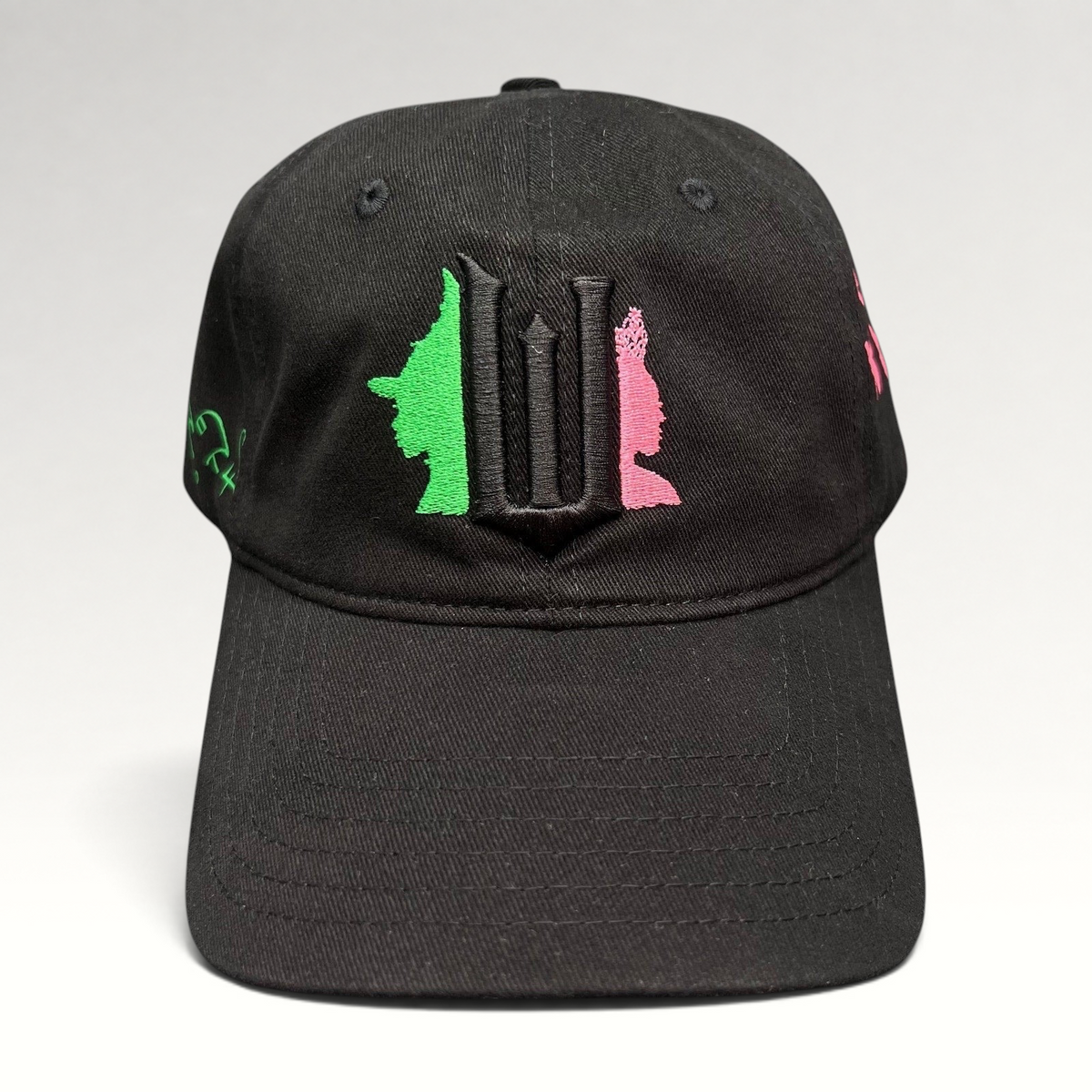 Raree Finds black cotton Wicked Broadway musical cap with green and pink character embroidery and gothic W emblem