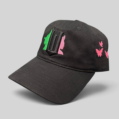 Raree Finds black cotton Wicked musical cap with green and pink embroidered character silhouettes and butterfly accents