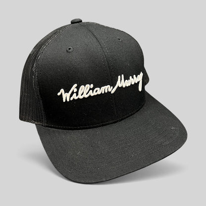 Raree Finds black William Murray Golf trucker hat with white script logo embroidery and structured mesh back