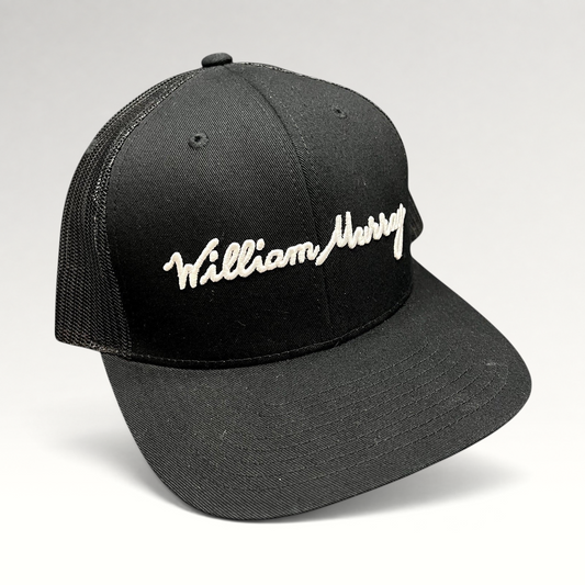 Raree Finds black William Murray Golf trucker hat with white script logo embroidery and structured mesh back