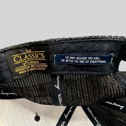 Raree Finds William Murray Golf trucker hat interior showing Yupoong Classics label and inspirational quote tag