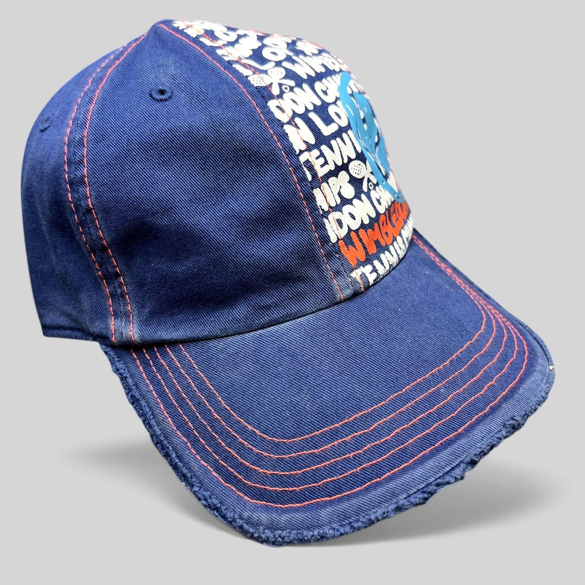 Raree Finds navy and orange distressed strapback hat with Wimbledon graphic print and frayed edges