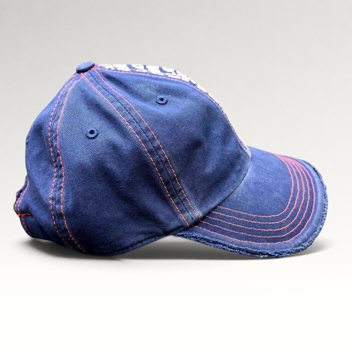 Raree Finds navy blue and orange distressed strapback hat with frayed edges and Wimbledon tournament graphic print
