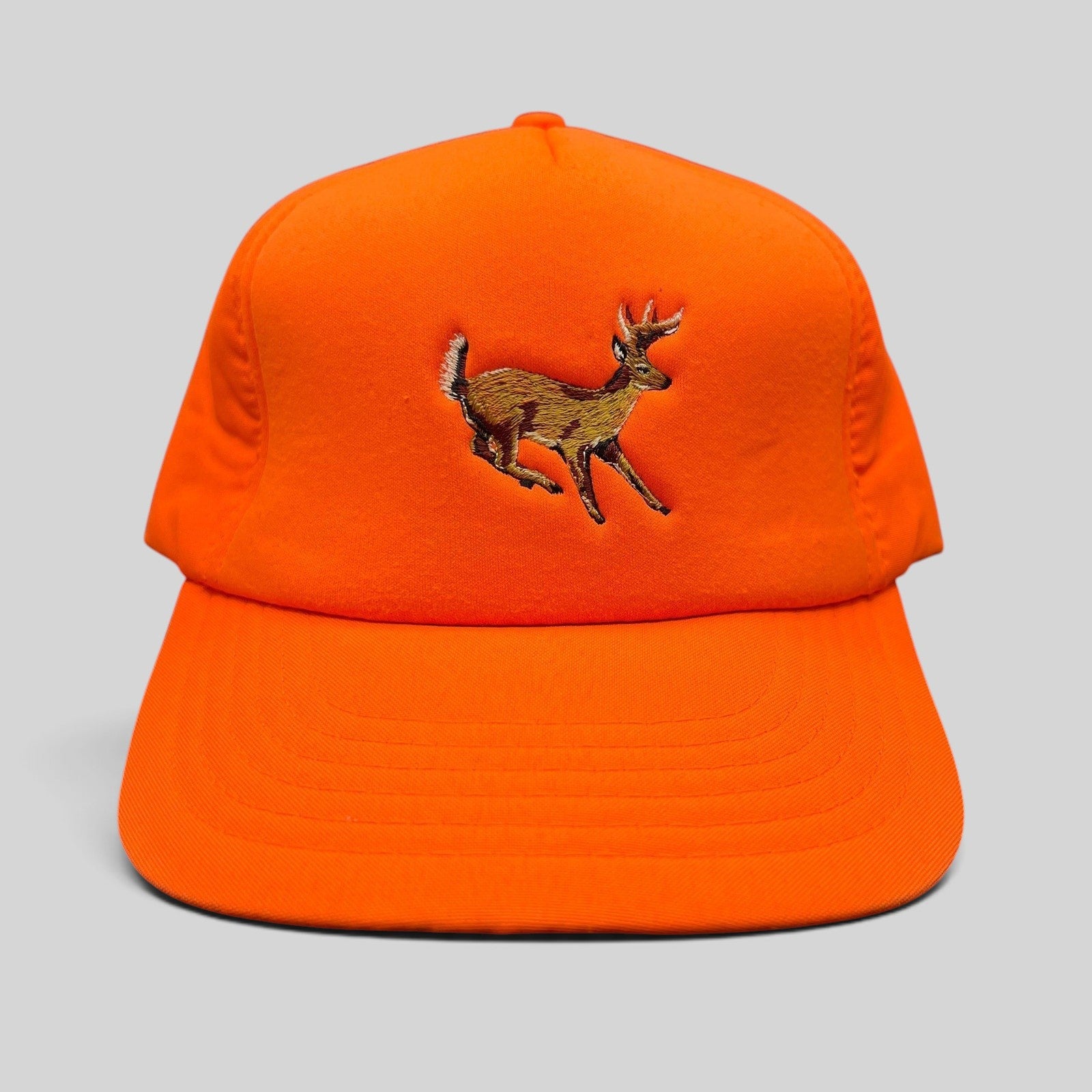 Raree Finds vintage Winchester blaze orange hunting snapback hat with an embroidered running deer graphic.