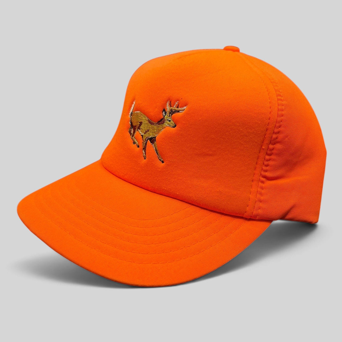 Raree Finds vintage Winchester blaze orange hunting snapback hat with embroidered deer logo and green undervisor.