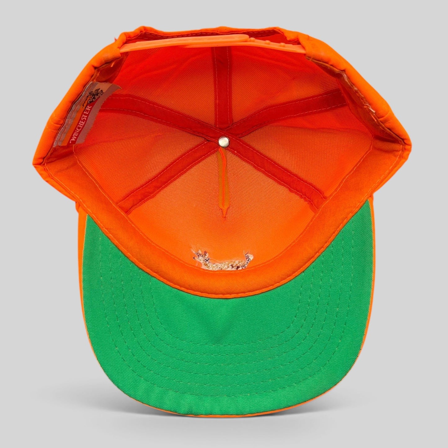 Raree Finds vintage Winchester blaze orange hunting snapback hat with green undervisor, interior view