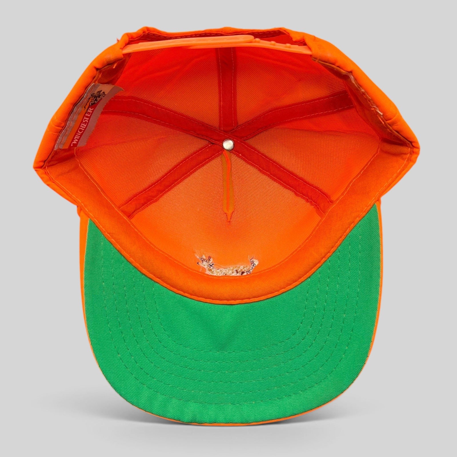 Raree Finds vintage Winchester blaze orange hunting snapback hat with green undervisor, interior view