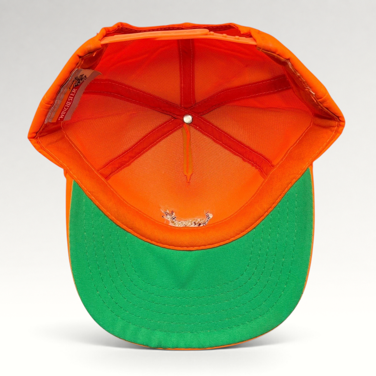 Raree Finds vintage Winchester blaze orange hunting snapback hat with green undervisor, interior view