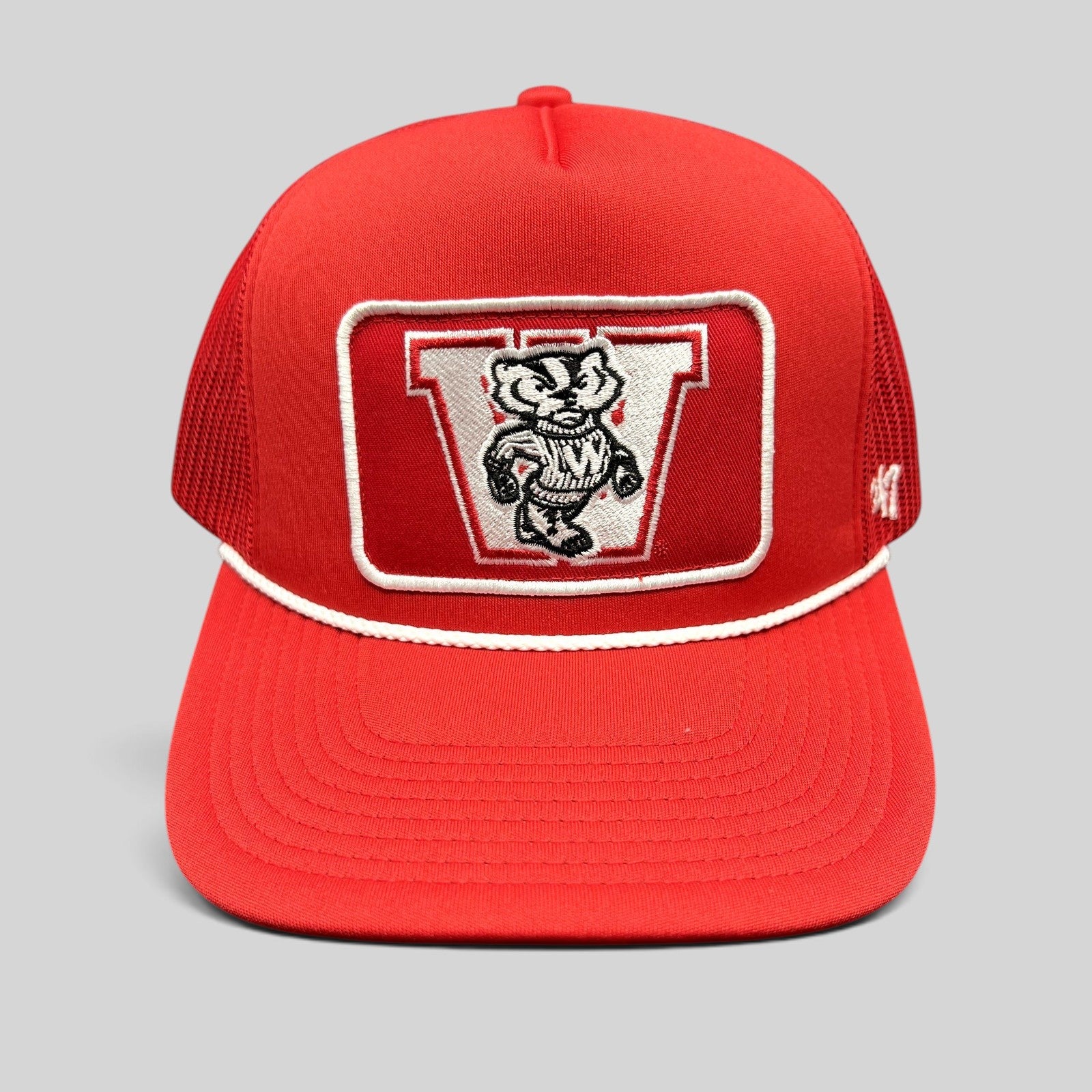 Raree Finds Wisconsin Badgers red trucker snapback hat with Bucky Badger embroidered patch and white rope detail.