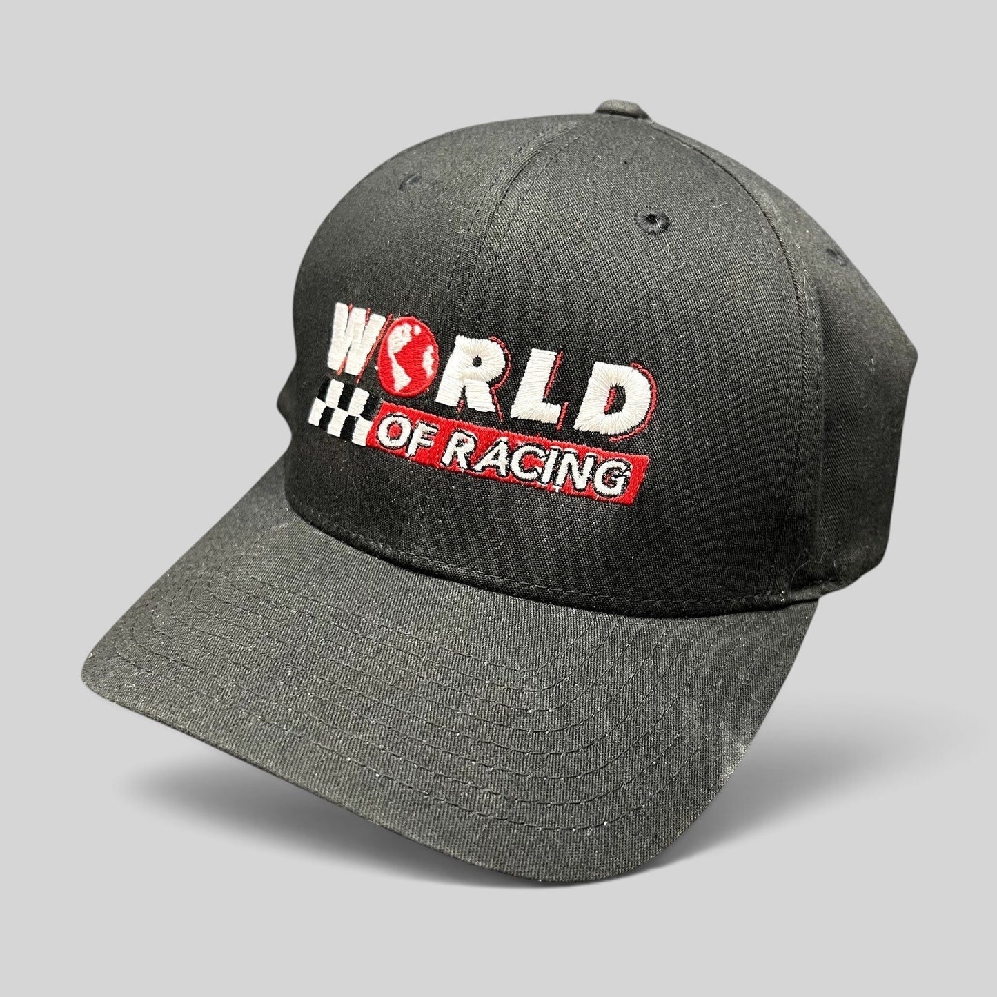 Raree Finds black Port Authority flexfit hat with World of Racing embroidered logo and checkered flag detail.