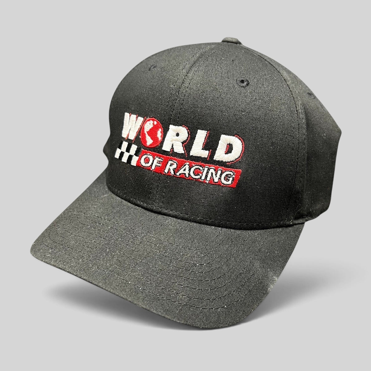 Raree Finds black Port Authority flexfit hat with World of Racing embroidered logo and checkered flag detail.