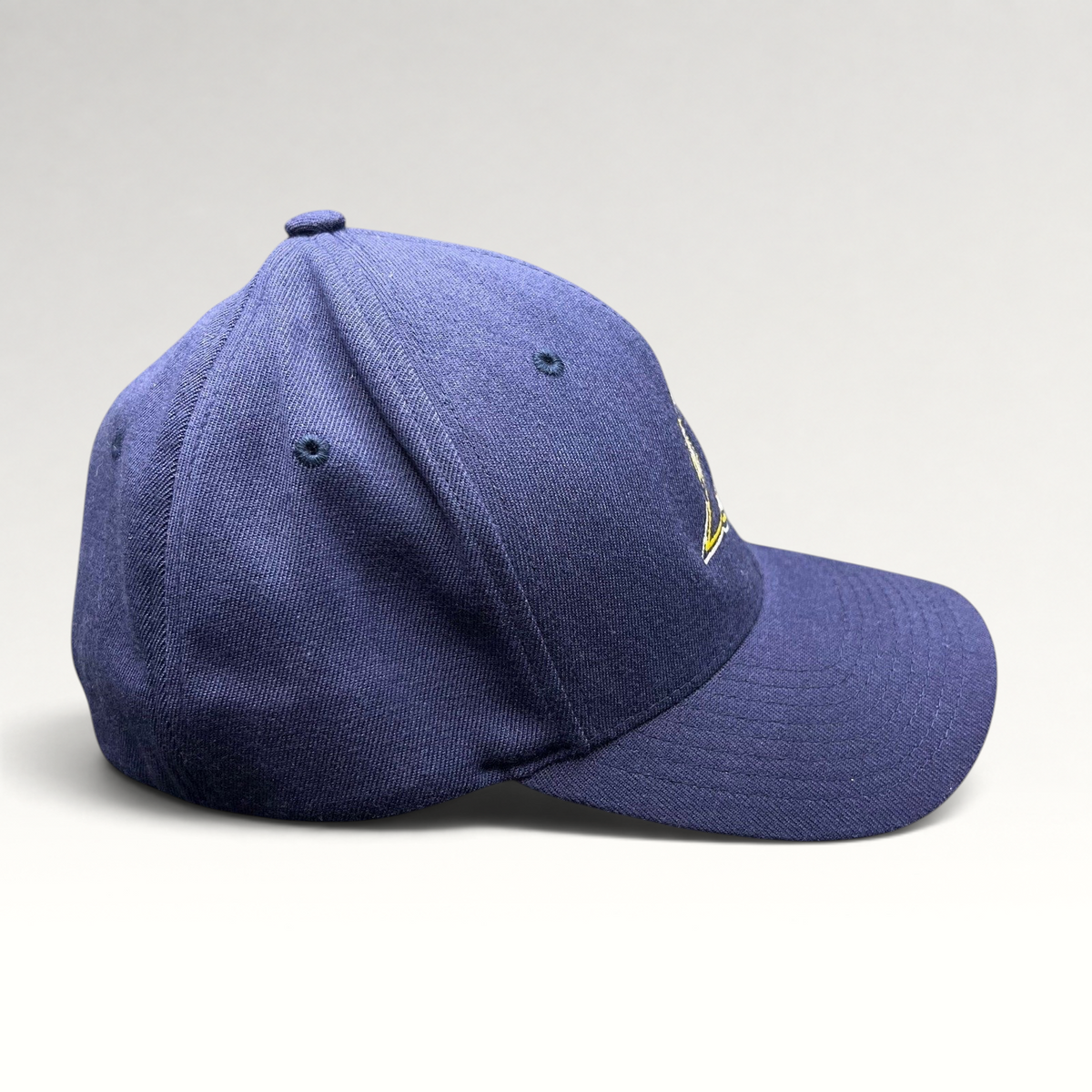 Raree Finds navy blue X-Men First Class film crew Flexfit hat with embroidered logo, side profile view.