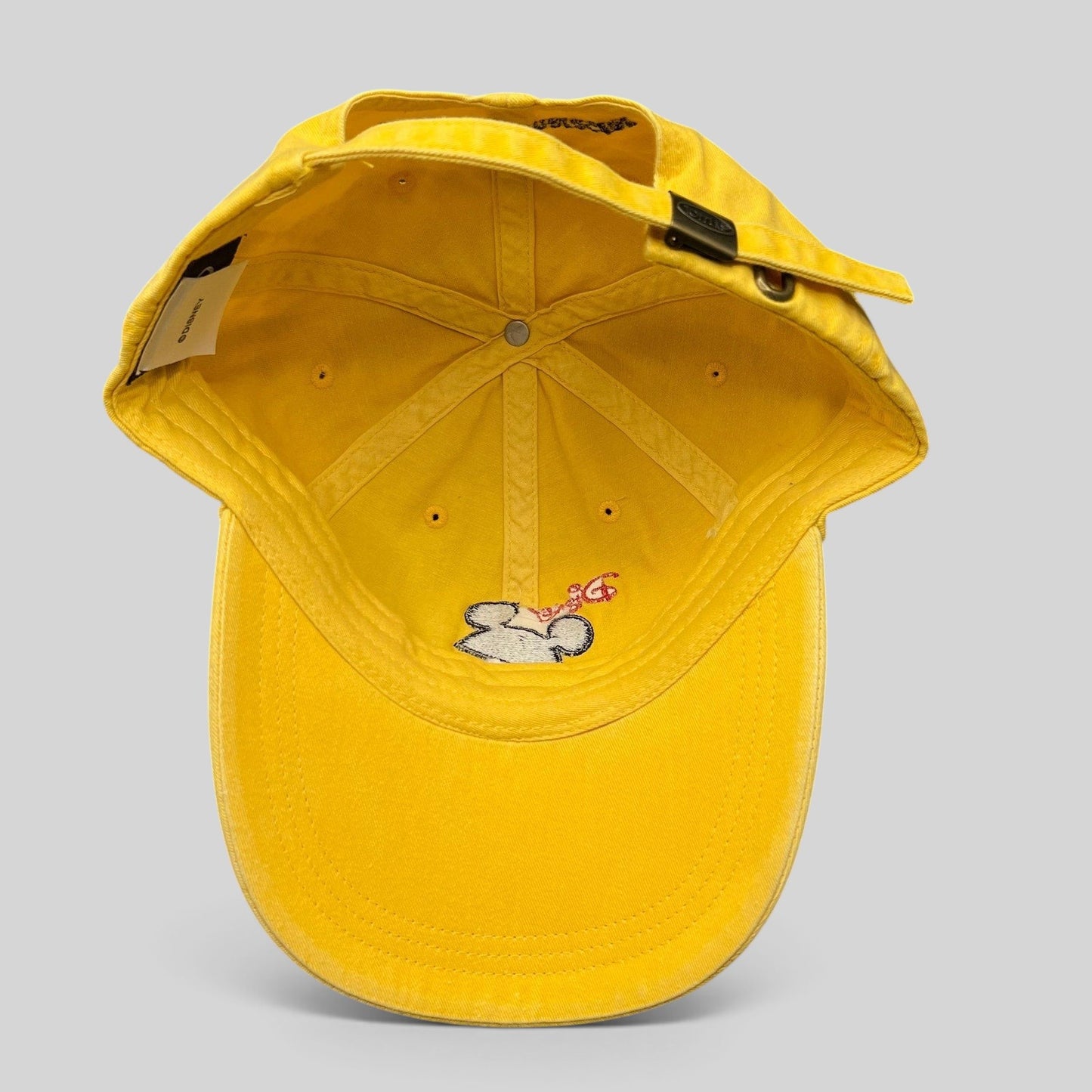 Raree Finds yellow Disney VoluntEARS cotton strapback hat with Mickey Mouse silhouette embroidery and adjustable strap