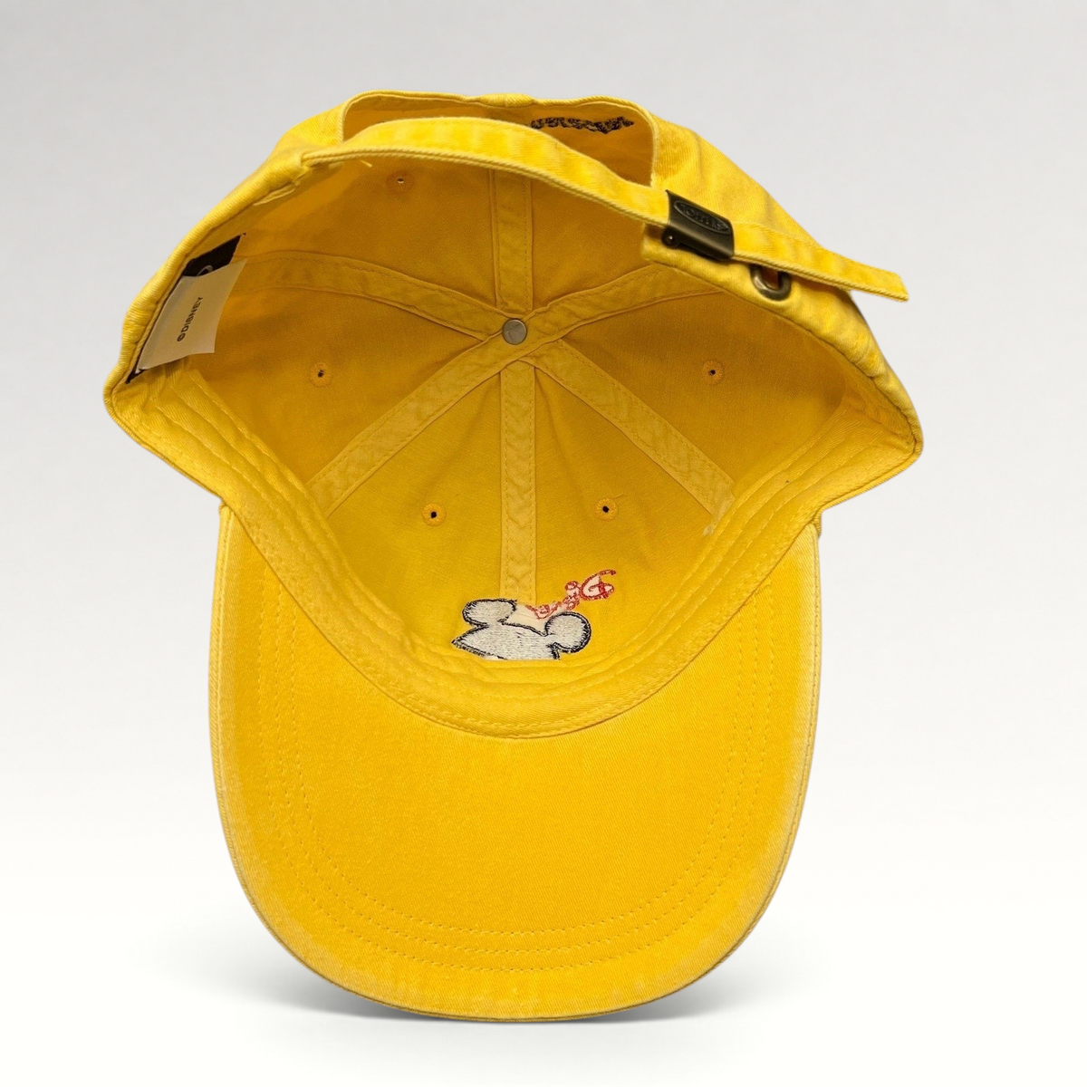 Raree Finds yellow Disney VoluntEARS cotton strapback hat with Mickey Mouse silhouette embroidery and adjustable strap
