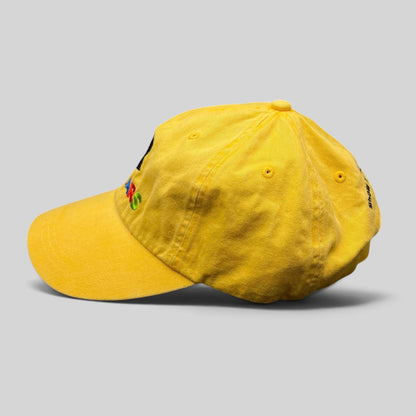 Raree Finds yellow Disney VoluntEARS cotton strapback hat with colorful Mickey embroidery and curved brim
