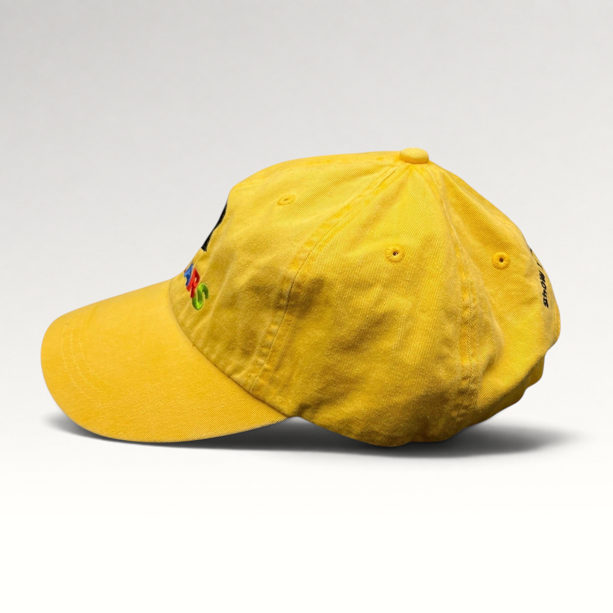 Raree Finds yellow Disney VoluntEARS cotton strapback hat with colorful Mickey embroidery and curved brim