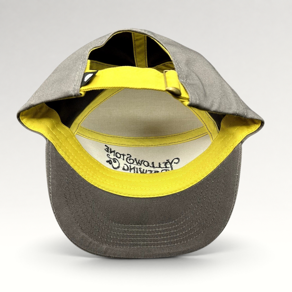 Raree Finds Yellowstone Brewing Co two-tone yellow and gray cotton strapback hat with brass buckle and curved brim